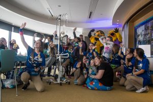Patients and volunteers do the Hawkeye Wave in the University of Iowa Stead Family Childrens Hospital during Dance Marathon 25 on Saturday, Feb. 2, 2019. (Shivansh Ahuja/The Daily Iowan)