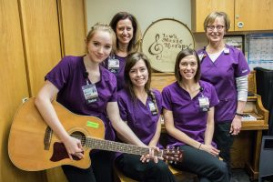 (From left) Student intern Abby Farmer, clinical specialist Kim Hawkins, student intern Courtney Phillips, senior activity therapist Katey Kooi, and pediatric specialist Kirsten Nelson pose for a portrait at the University of Iowa Hospitals and Clinics on Wednesday, February 27, 2019.