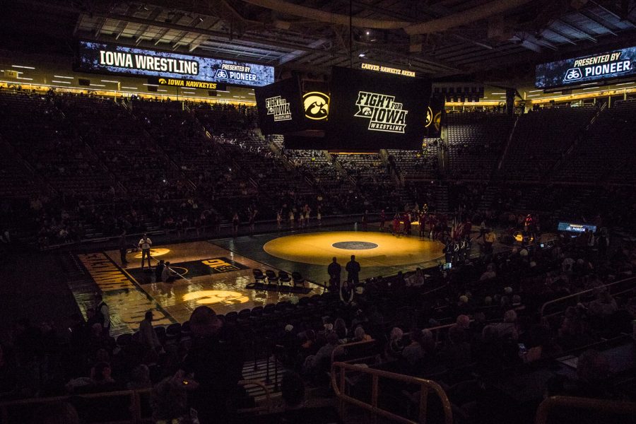 Lights+are+dimmed+during+a+wrestling+match+between+Iowa+and+Indiana+at+Carver-Hawkeye+Arena+on+Friday%2C+February+15%2C+2019.+The+Hawkeyes%2C+celebrating+senior+night%2C+defeated+the+Hoosiers+37-9.