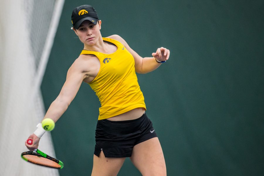 Iowas Elise Van Heuvelen Treadwell hits a forehand during a womens tennis matchup between Iowa and Iowa State at the Hawkeye Tennis and Recreation Complex on Friday, February 8, 2019.  The Hawkeyes dropped the doubles point but swept singles matches, defeating the Cyclones 4-1.