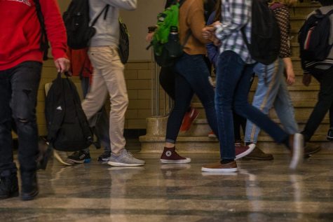 Students traverse a hallway at Iowa City High School on Wednesday, February 13, 2019. 