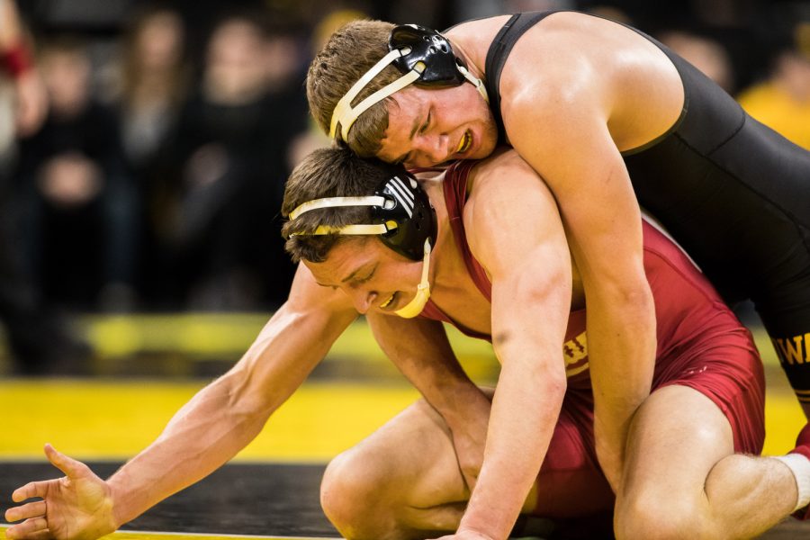 Iowa's No. 4 Jacob Warner wrestles Indiana's Jake Kleimola at 197lb during a wrestling match between Iowa and Indiana at Carver-Hawkeye Arena on Friday, February 15, 2019. The Hawkeyes, celebrating senior night, defeated the Hoosiers 37-9.