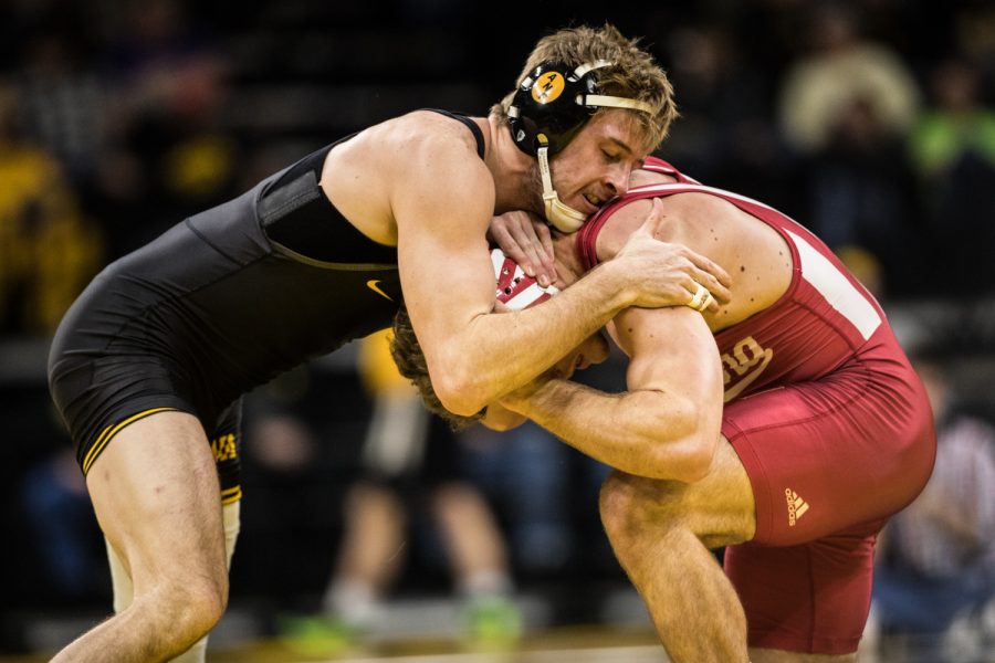 Iowas Mitch Bowman wrestles Indianas Jacob Covaciu during a wrestling match between Iowa and Indiana at Carver-Hawkeye Arena on Friday, February 19, 2019. The Hawkeyes, celebrating senior night, defeated the Hoosiers 37-9.