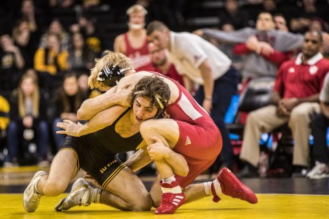 Iowas No. 3 Austin DeSanto wrestles Indianas Paul Konrath at 133lb during a wrestling match between Iowa and Indiana at Carver-Hawkeye Arena on Friday, February 15, 2019. The Hawkeyes, celebrating senior night, defeated the Hoosiers 37-9.