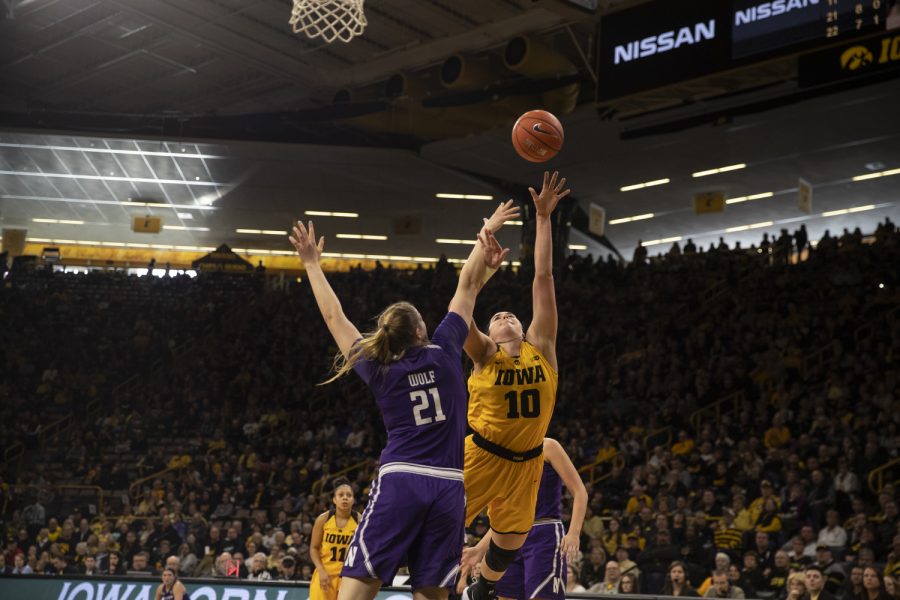 Forward+Megan+Gustafson+goes+in+for+a+lay-up+during+womens+basketball+against+Northwestern+in+Carver-Hawkeye+Arena+on+March+3%2C+2019.+Iowa+defeated+Northwestern+74-50.+