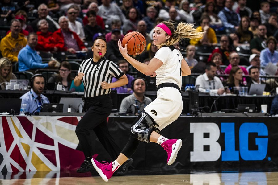 Iowa guard Makenzie Meyer gets a hold of the ball during the womens Big Ten tournament basketball game vs. Rutgers at Bankers Life Fieldhouse on Saturday, March 9, 2019. The Hawkeyes defeated the Scarlet Knights 72-67 and will be moving on to the championship game against Maryland. (Katina Zentz/The Daily Iowan)