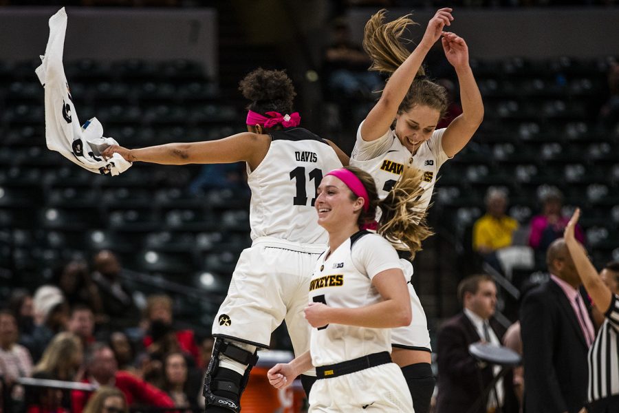 Iowa guards Tania Davis and Kathleen Doyle celebrate during the womens Big Ten tournament basketball game vs. Rutgers at Bankers Life Fieldhouse on Saturday, March 9, 2019. The Hawkeyes defeated the Scarlet Knights 72-67 and will be moving on to the championship game against Maryland.