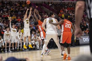 Iowa forward Nicholas Baer (51) attempts a 3-pointer during the Iowa/Illinois Big Ten Tournament mens basketball game in the United Center in Chicago on Thursday, March 14, 2019. (Lily Smith/The Daily Iowan)
