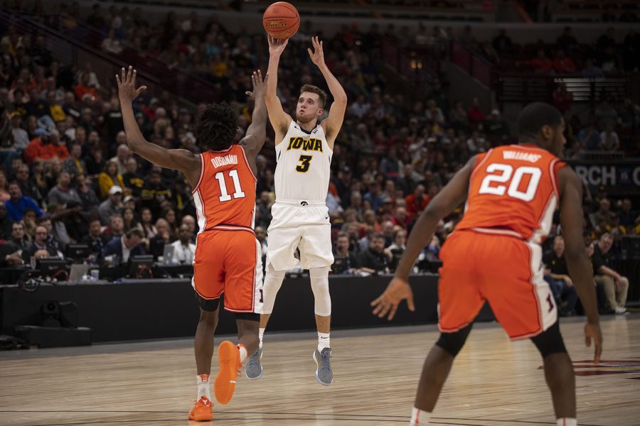 Iowa+guard+Jordan+Bohannon+attempts+a+3-pointer+during+the+Iowa%2FIllinois+Big+Ten+Tournament+mens+basketball+game+in+the+United+Center+in+Chicago+on+Thursday%2C+March+14%2C+2019.+The+Hawkeyes+defeated+the+Fighting+Illini%2C+83-62.+