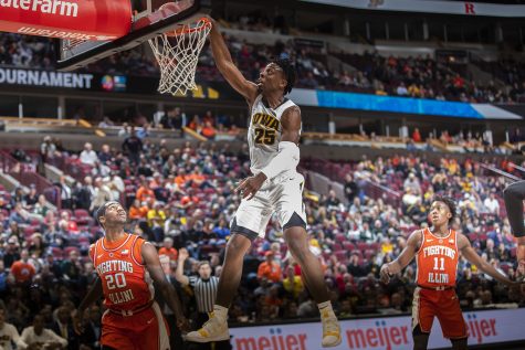 Iowa forward Tyler Cook dunks during the Iowa/Illinois Big Ten Tournament mens basketball game in the United Center in Chicago on Thursday, March 14, 2019. The Hawkeyes defeated the Fighting Illini, 83-62. 
