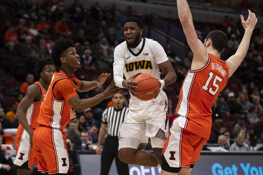 Iowa guard Isaiah Moss drives to the basket during the Iowa/Illinois Big Ten Tournament mens basketball game in the United Center in Chicago on Thursday, March 14, 2019. The Hawkeyes defeated the Fighting Illini, 83-62. (Lily Smith/The Daily Iowan)