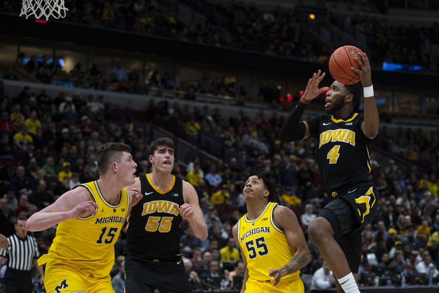 Iowa guard Isaiah Moss attempts a shot during the Iowa/Michigan Big Ten Tournament mens basketball game in the United Center in Chicago on Friday, March 15, 2019. The Wolverines defeated the Hawkeyes, 74-53.