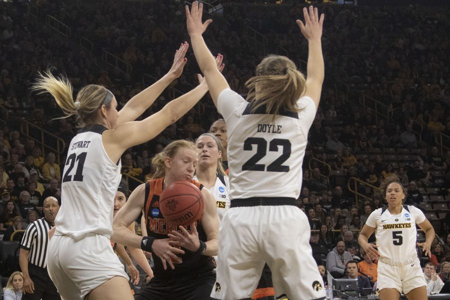 Mercer forward Amanda Thompson attempts to regain control of the ball during the Iowa/Mercer NCAA Tournament first round womens basketball game in Carver-Hawkeye Arena  on Friday, March 22, 2019. The Hawkeyes defeated the Bears, 66-61.