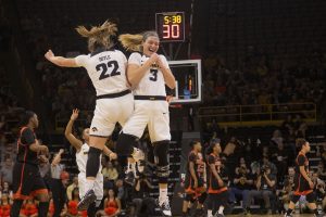 Iowa guard Makenzie Meyer (3) and Iowa guard Kathleen Doyle (22) celebrate during the Iowa/Mercer NCAA Tournament first round womens basketball game in Carver-Hawkeye Arena  on Friday, March 22, 2019. The Hawkeyes defeated the Bears, 66-61.