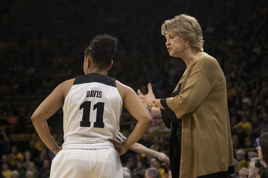 Iowa head coach Lisa Bluder speaks to Iowa guard Tania Davis during the Iowa/Mercer NCAA Tournament first round womens basketball game in Carver-Hawkeye Arena  on Friday, March 22, 2019. The Hawkeyes defeated the Bears, 66-61.