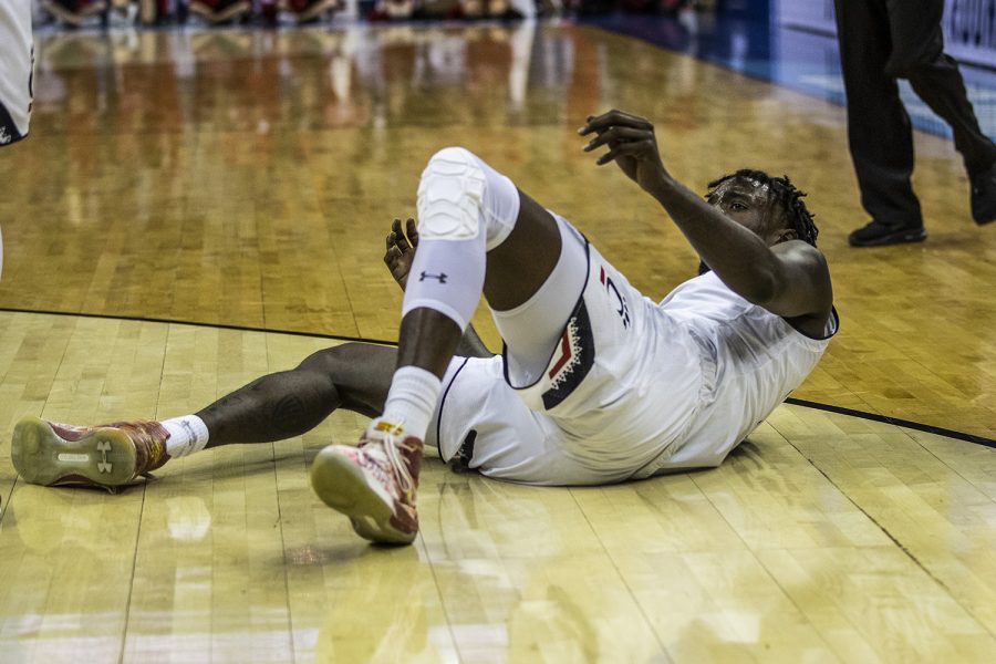 Cincinnati center Nysier Brooks falls to the ground during the NCAA game against Cincinnati at Nationwide Arena on Friday, March 22, 2019. The Hawkeyes defeated the Bearcats 79-72.