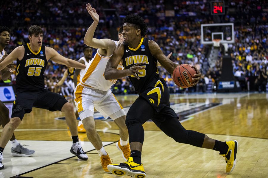 Iowa forward Tyler Cook drives past Tennessee forward John Fulkerson during the NCAA game against Tennessee at Nationwide Arena on Sunday, March 24, 2019. The Volunteers defeated the Hawkeyes 83-77 in overtime.