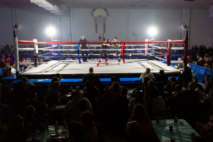 Melissa Bunch (center) and Autumn Gibson dance in the ring during the Midwest Kickboxing Championship in Cedar Rapids on Saturday, Mar. 2, 2019. Gibson won via unanimous decision and improved her kickboxing record to 1-2. 