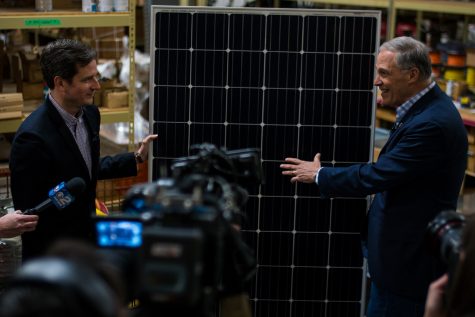 Washigton Governor Jay Inslee stopped by Paulson Electric Co in Cedar Rapids on Tuesday March 5, 2019. Jay Inslee talked with CEO Tyler Olson about climate change and how solar pannels combat its effects. (Roman Slabach/The Daily Iowan).