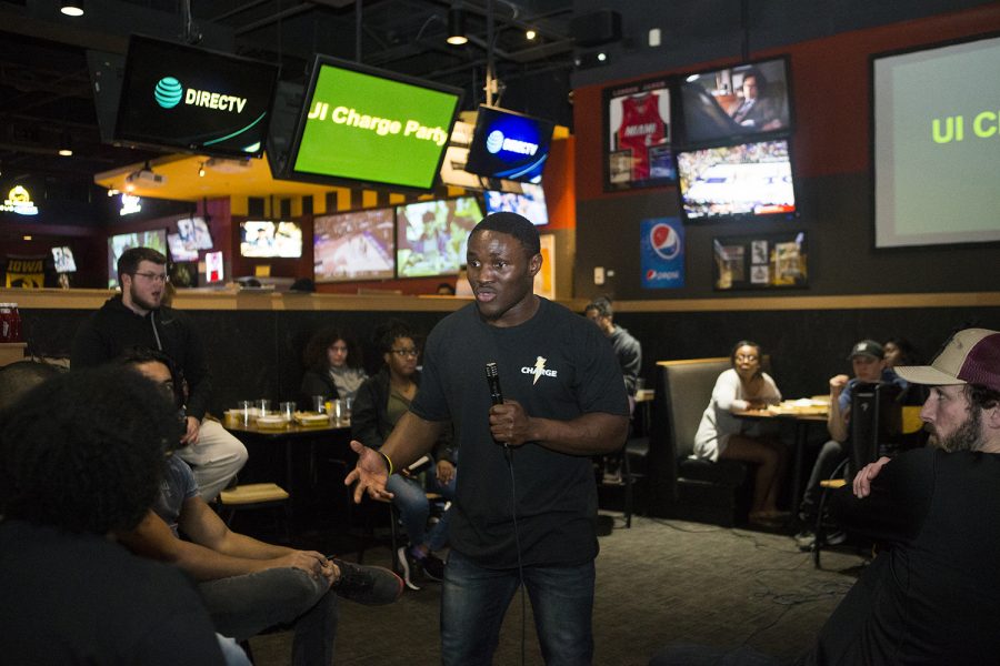 Dady Mansary announces his candidacy for UISG president, representing the Charge Party at Buffalo Wild Wings on Sunday, March 24.(Reba Zatz/The Daily Iowan)