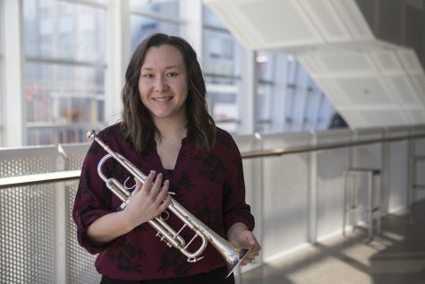 Toni LeFebvre poses for a portrait with her trumpet in the Voxman Music Building on Wednesday, March 6, 2019. (Jenna Galligan /The Daily Iowan)