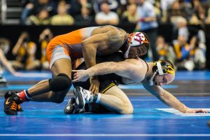 Iowa’s 165-pound Alex Marinelli wrestles Virginia Tech’s Mekhi Lewis during the third session of the 2019 NCAA D1 Wrestling Championships at PPG Paints Arena in Pittsburgh, PA on Friday, March 22, 2019. Lewis won by decision, 3-1. 
