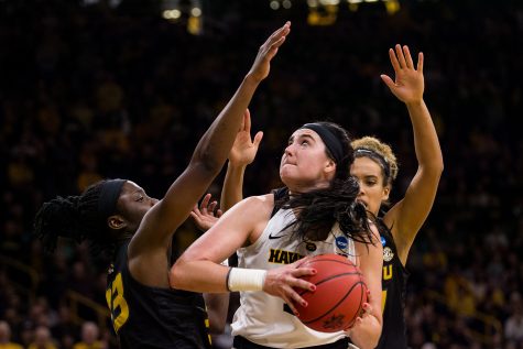 Iowa center Megan Gustafson (10) attempts a shot during the Iowa/Missouri NCAA Tournament second round women’s basketball game in Carver-Hawkeye Arena in Iowa City, Iowa on Sunday, March 24, 2019. The Hawkeyes defeated the Tigers 68-52.