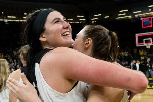 Iowa center Megan Gustafson (10) hugs Iowa forward Amanda Ollinger after the Iowa/Missouri NCAA Tournament second round women’s basketball game in Carver-Hawkeye Arena in Iowa City, Iowa on Sunday, March 24, 2019. The Hawkeyes defeated the Tigers 68-52.