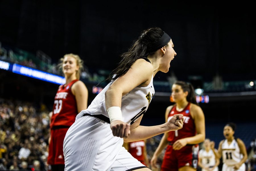 Iowa center Megan Gustafson celebrates after shooting a basket during the NCAA Sweet Sixteen game against NC State at the Greensboro Coliseum Complex on Saturday, March 30, 2019. The Hawkeyes lead the Wolfpack 37-24 at half.