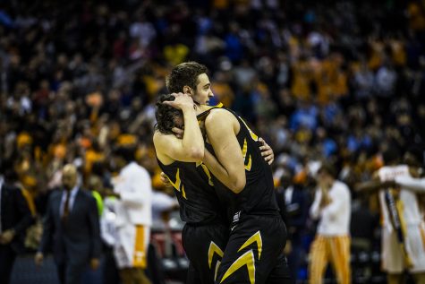 Iowa forward Nicholas Baer comforts Luka Garza after the loss against Tennessee in the NCAA tournament at Nationwide Arena on Sunday, March 24, 2019. The Volunteers defeated the Hawkeyes 83-77. 