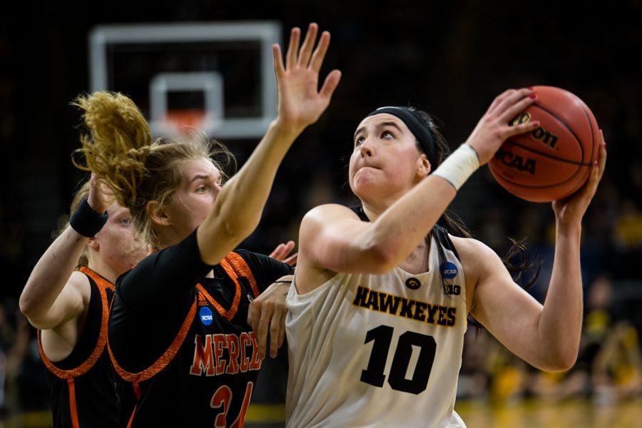 Iowa center Megan Gustafson (10) goes up for a rebound during the Iowa/Mercer NCAA Tournament first round women’s basketball game in Carver-Hawkeye Arena in Iowa City, Iowa on Friday, March 22, 2019. The Hawkeyes beat the Bears 66-61.