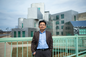 University of Iowa engineering professor Jun Wang stands outside the Iowa Advanced Technology Laboratories on March 27. 