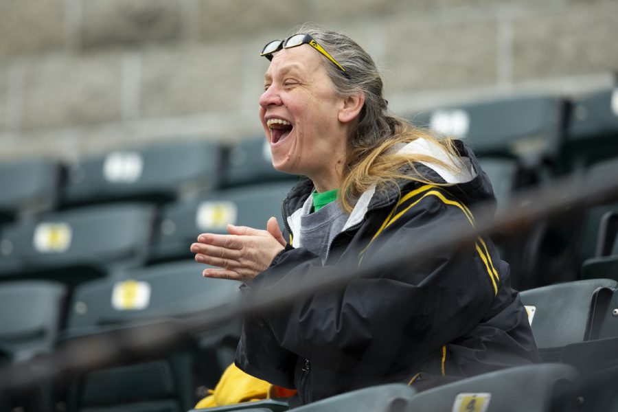 Keri Jamaszak cheers on the Hawkeyes as they score their first run of the game. Jamaszak says she enjoys watching the players. They never give up. The Hawkeyes defeated the Illini 8-4 at Duane Banks Field on Mar 29, 2019.