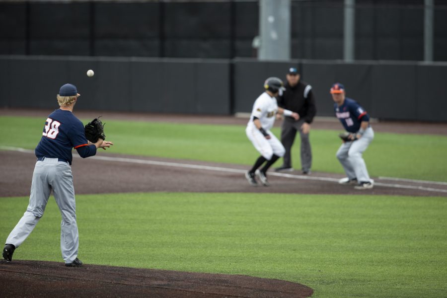 Illinois pitcher Andy Fisher makes a pickoff throw. The Hawkeyes defeated the Illini 8-4 at Duane Banks Field on Mar 29, 2019. 