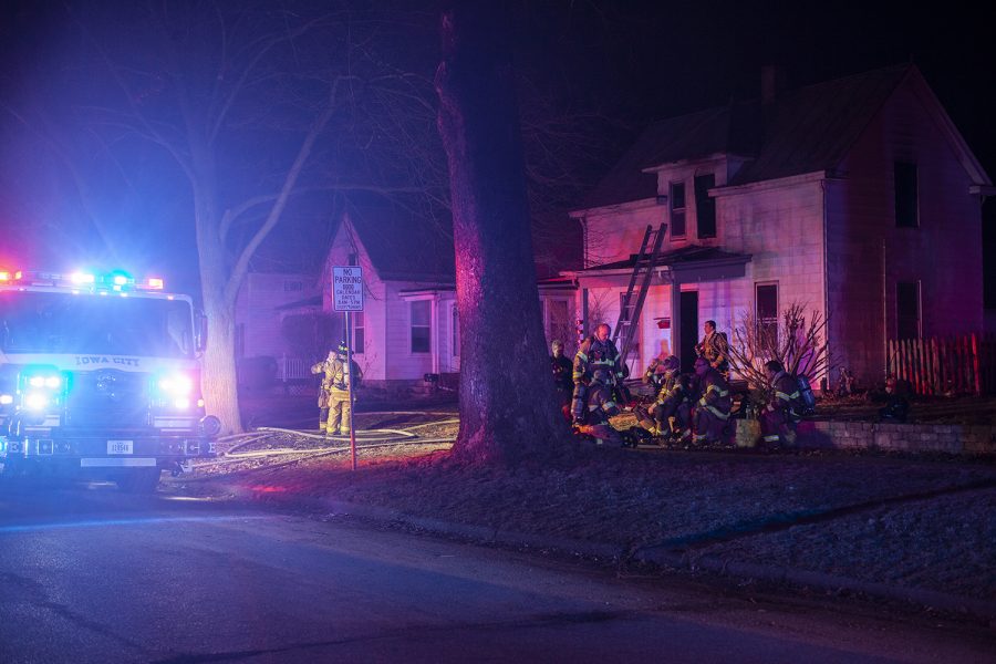 Firefighters respond to a report of a fire at a residence on Davenport Street in Iowa City on Tuesday, March 19, 2019.