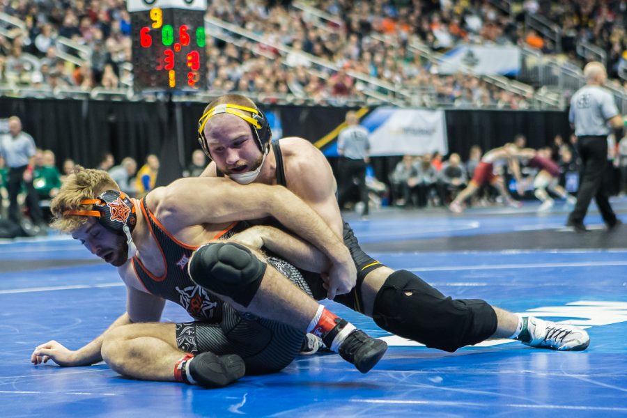 Iowa’s 165-pound Alex Marinelli wrestles Oklahoma State’s Joseph Smith during the first session of the 2019 NCAA D1 Wrestling Championships at PPG Paints Arena in Pittsburgh, PA on Thursday, March 21, 2019. Marinelli won by decision, 7-4.