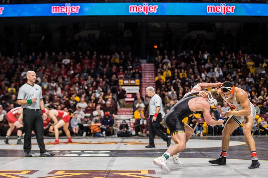 Iowa's 184-lb Cash Wilcke wrestles Illinois' Emery Parker during the first session of the 2019 Big Ten Wrestling Championships in Minneapolis, MN on Saturday, March 9, 2019. Parker won by decision, 7-3.