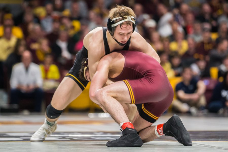 Iowa's 125-lb Spencer Lee wrestles Minnesota's Sean Russell during the second session of the 2019 Big Ten Wrestling Championships in Minneapolis, MN on Saturday, March 9, 2019. Lee won by major decision, 8-0. 