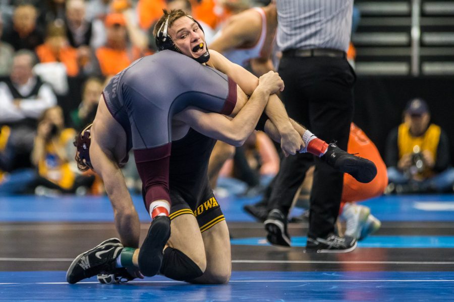 Iowa’s 125-pound Spencer Lee wrestles Minnesota’s Sean Russell during the third session of the 2019 NCAA D1 Wrestling Championships at PPG Paints Arena in Pittsburgh, PA on Friday, March 22, 2019. Lee defeated Russell by fall.