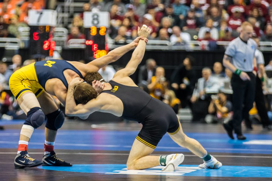 Iowa’s 133-pound Austin DeSanto wrestles Michigan’s Stevan Micic during the third session of the 2019 NCAA D1 Wrestling Championships at PPG Paints Arena in Pittsburgh, PA on Friday, March 22, 2019. Micic won by decision, 3-2.