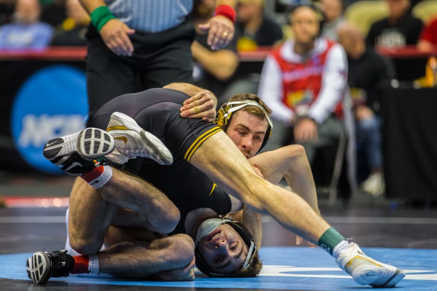 Iowa’s 133-pound Austin DeSanto wrestles Missouri’s John Erneste during the fifth session of the 2019 NCAA D1 Wrestling Championships at the PPG Paints Arena in Pittsburgh, PA on Saturday, March 23, 2019. Desanto won by decision, 11-6, and earned fifth in the weight class.