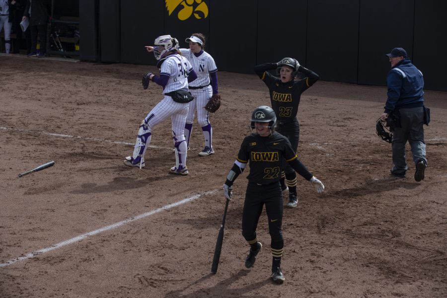 Infielder Alex Rath reacts after her slide home was ruled an out during softball against Northwestern on Bob Pearl Field on March 30, 2019. The Wildcats defeated the Hawkeyes 6-2.