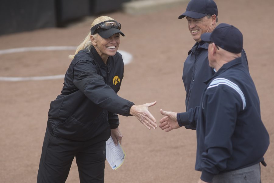 Iowa head coach Renee Gillispie shakes hands with the umpires before the conference opening softball game at Pearl Field on Friday, March 29, 2019. This is Gillispie's first season coaching the Hawkeyes. The Wildcats defeated the Hawkeyes 5-1. 