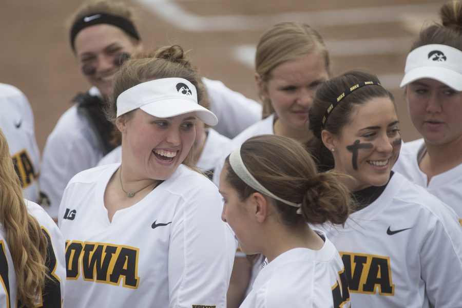 Iowa players celebrate the end of a promising first inning during the conference opening softball game at Pearl Field on Friday, March 29, 2019. Neither team scored any runs the first inning. The Wildcats defeated the Hawkeyes 5-1. 