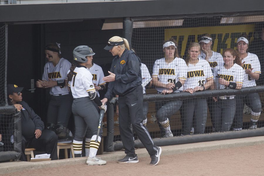 Iowa fielder Lea Thompson receives coaching from head coach Renee Gillispie after striking out during the conference opening softball game at Pearl Field on Friday, March 29, 2019. The Wildcats defeated the Hawkeyes 5-1. 