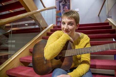 UI junior Clara Reynen poses for a portrait at the Theatre Building on Wednesday, March 6, 2019. Reynen writes her own folk music and performs on stage when not doing stand-up comedy.