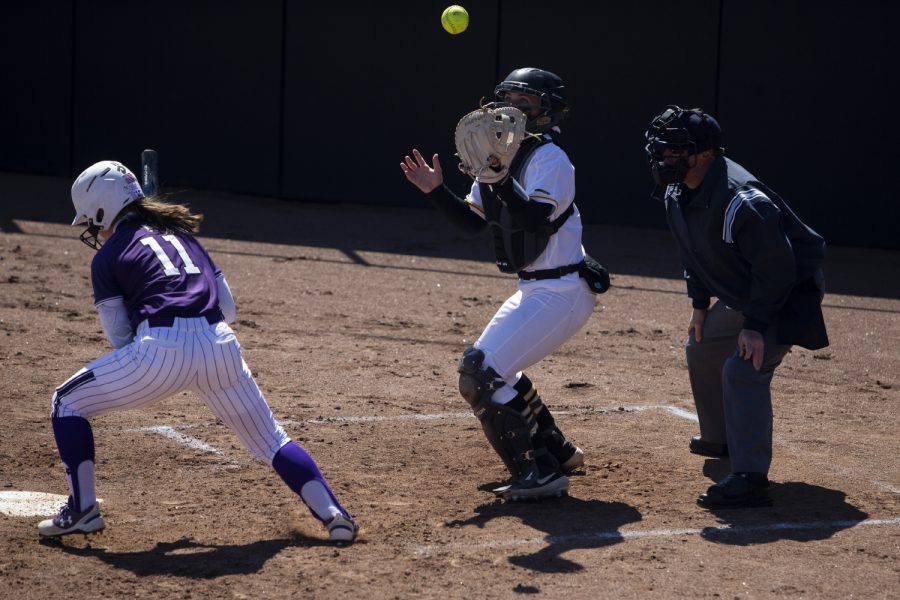 Iowa catcher Abby Lien catches a ball that came off of her glove during a softball game between Iowa and Northwestern on Sunday, March 31, 2019. The Hawkeyes lost to the Wildcats 6-0.