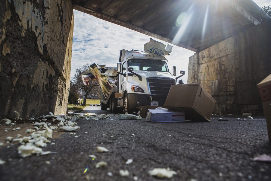 A Sysco truck crashes into the railroad above Iowa Avenue on Friday, March 29, 2019. 