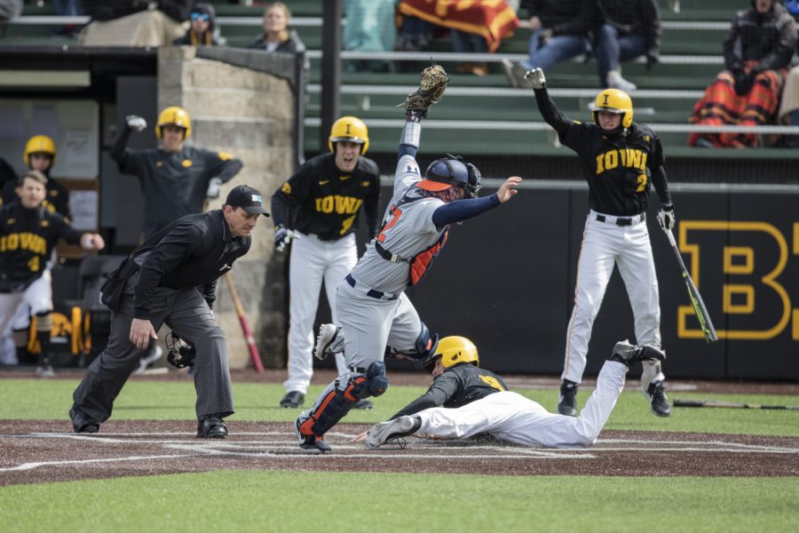 Hawkeye center-fielder Ben Norman slides into home during the baseball game against Illinois at Duane Banks Field on March 30, 2019. The Hawkeyes defeated the Fighting Illini 2-1 after the 9th inning.