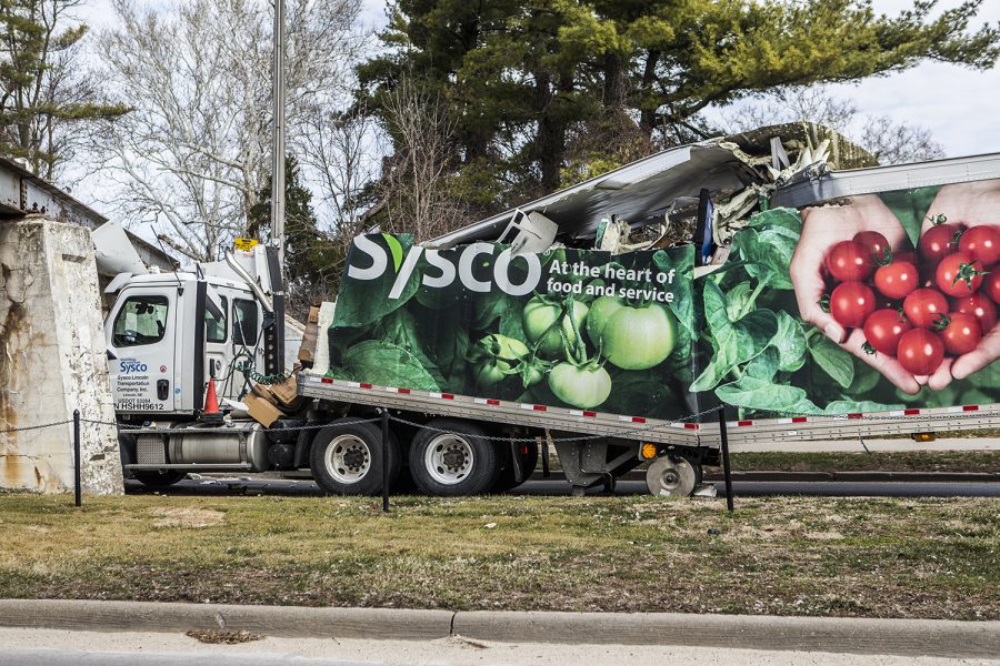 A Sysco truck crashes into the railroad above Iowa Avenue on Friday, March 29, 2019. 